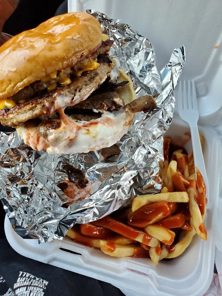 Double Gyro Cheeseburger with Just Mild Sauce and Tahiti Sauce Extra Cheese